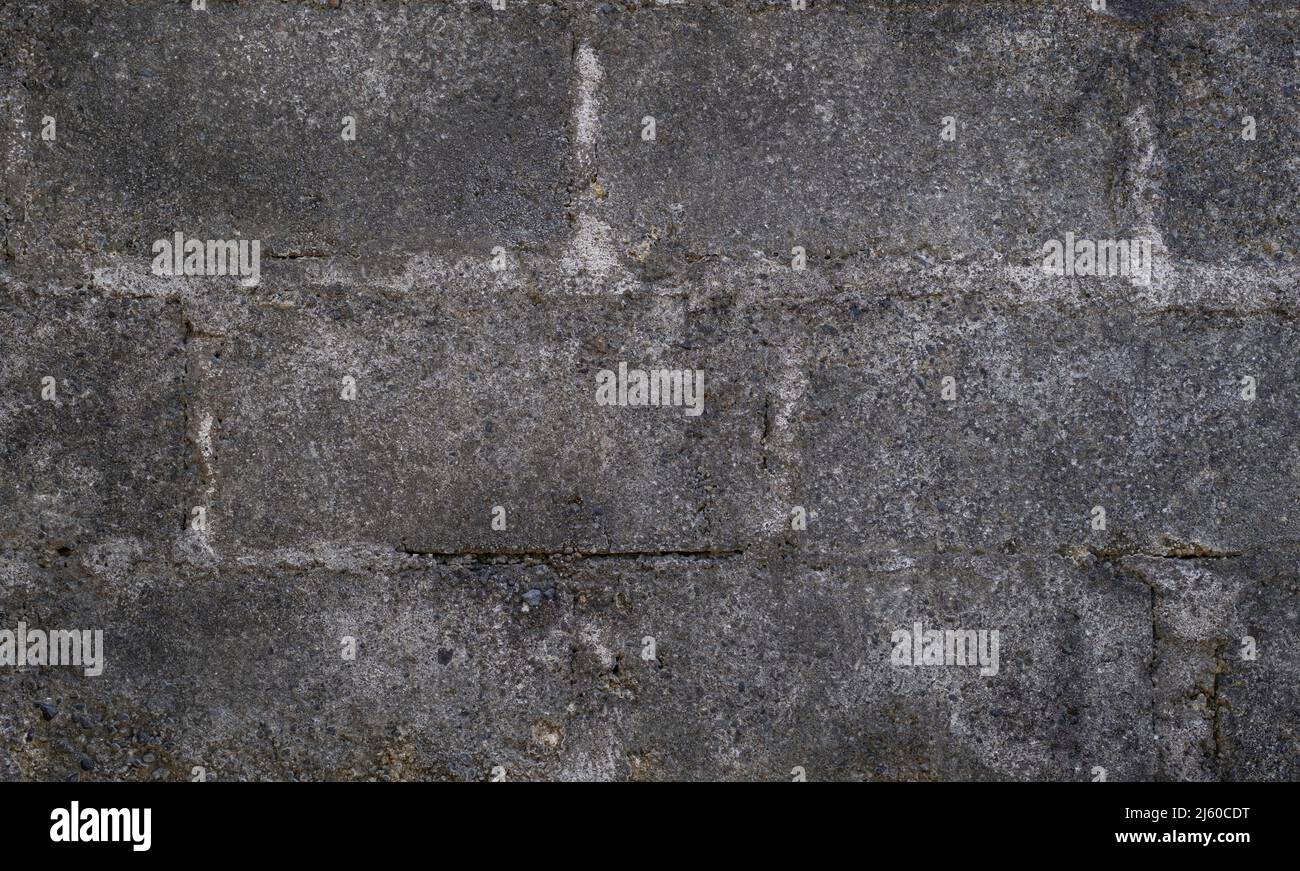 Old dark gray concrete block wall with gray mortar Stock Photo Alamy