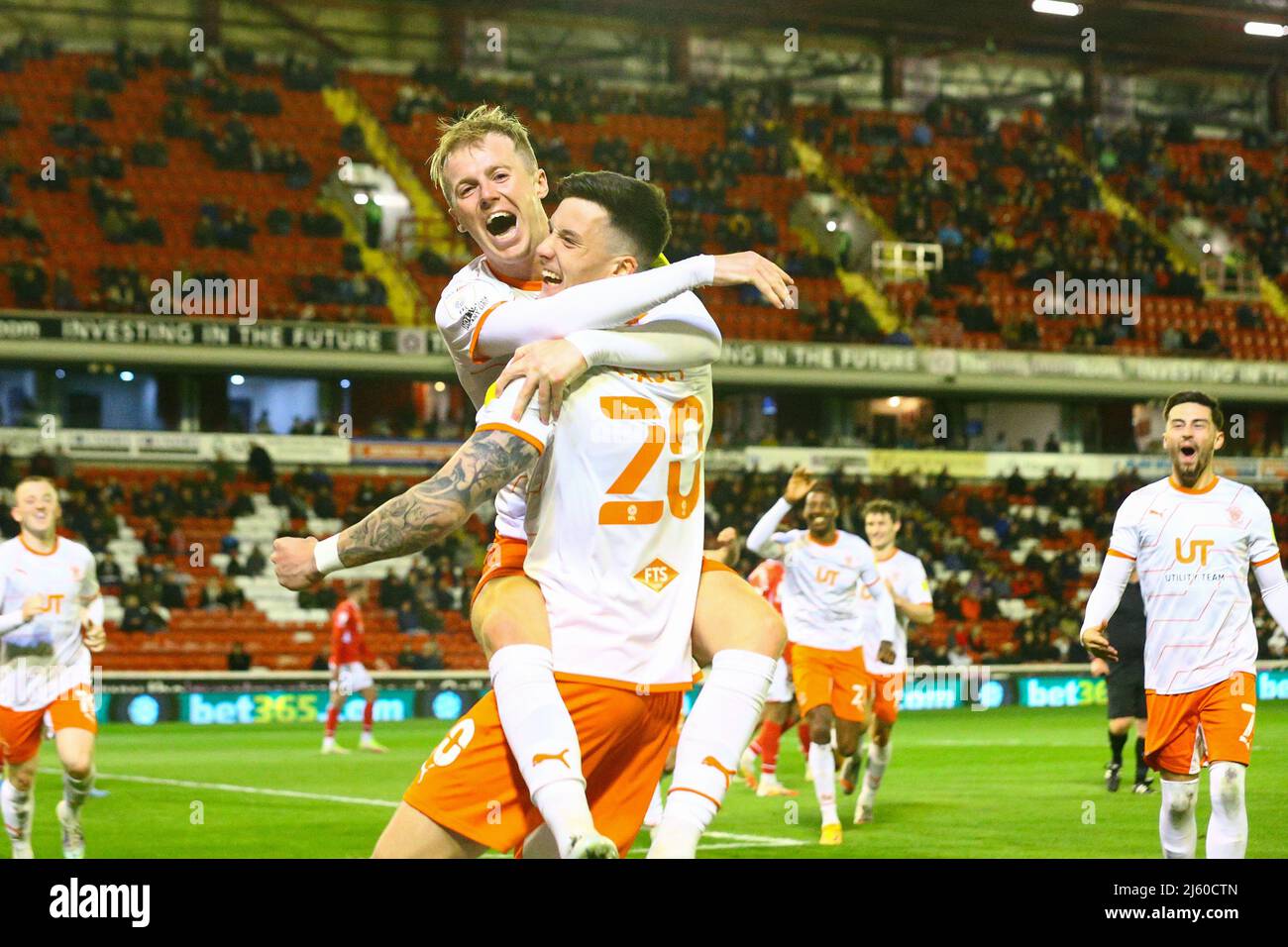 Oakwell, Barnsley, England - 26th April 2022 Oliver Casey (20) of Blackpool celebrates with Charlie Kirk after making it 0 - 2  during the game Barnsley v Blackpool, Sky Bet EFL Championship 2021/22, at Oakwell, Barnsley, England - 26th April 2022  Credit: Arthur Haigh/WhiteRosePhotos/Alamy Live News Stock Photo