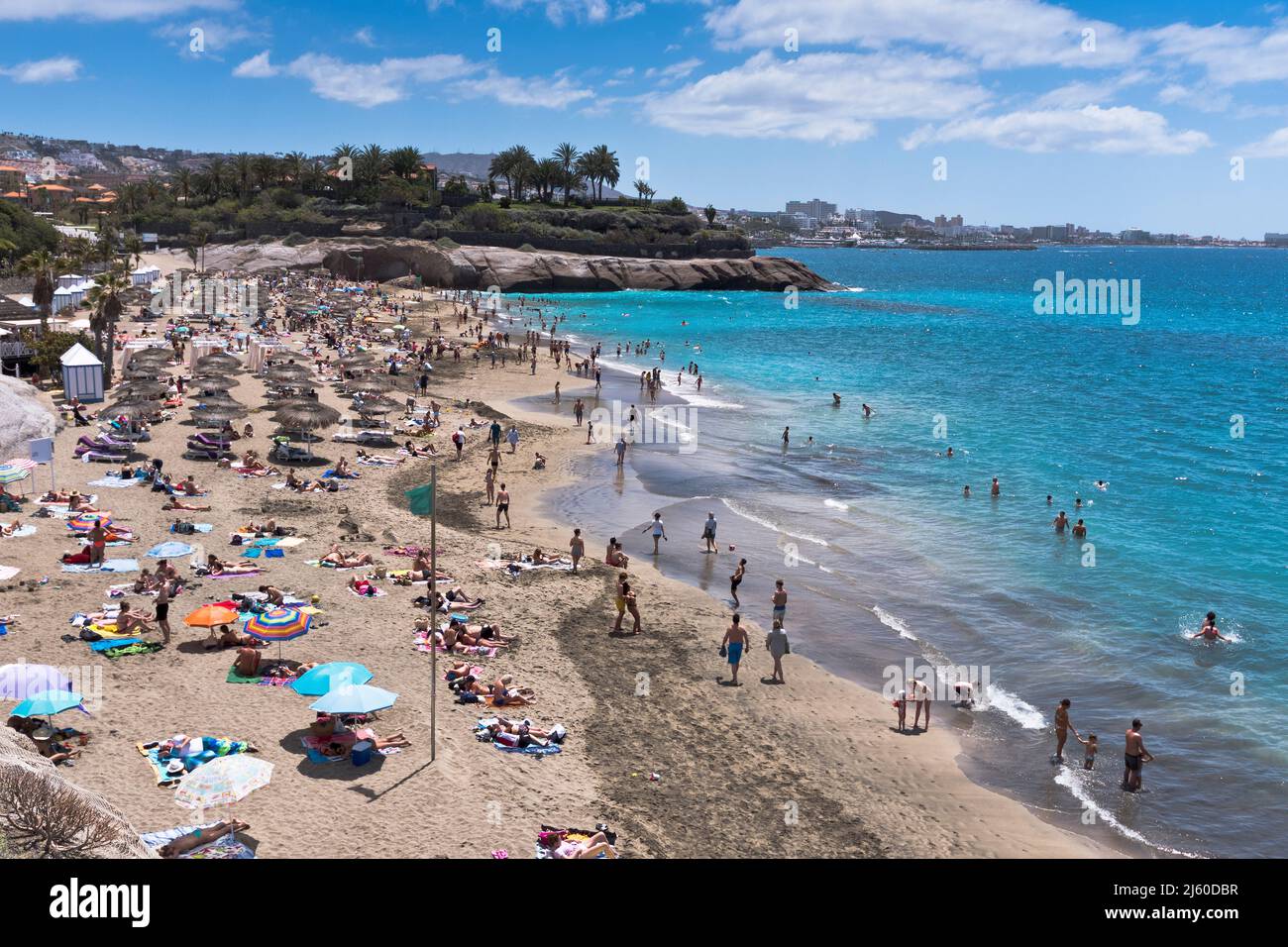 dh Playa del Duque COSTA ADEJE TENERIFE Tourist holiday beach people south coast beaches Stock Photo