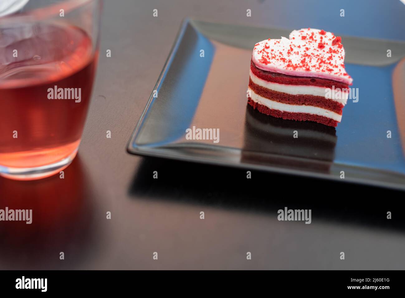 Red Velvet cake with tea and coffee in an urban coffee shop terrace