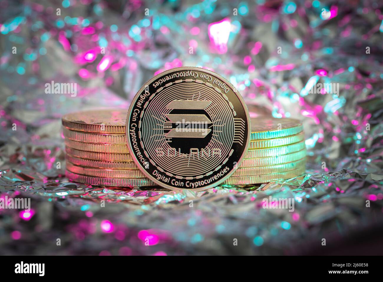 Solana SOL cryptocurrency physical coin, abstract background. Stock Photo