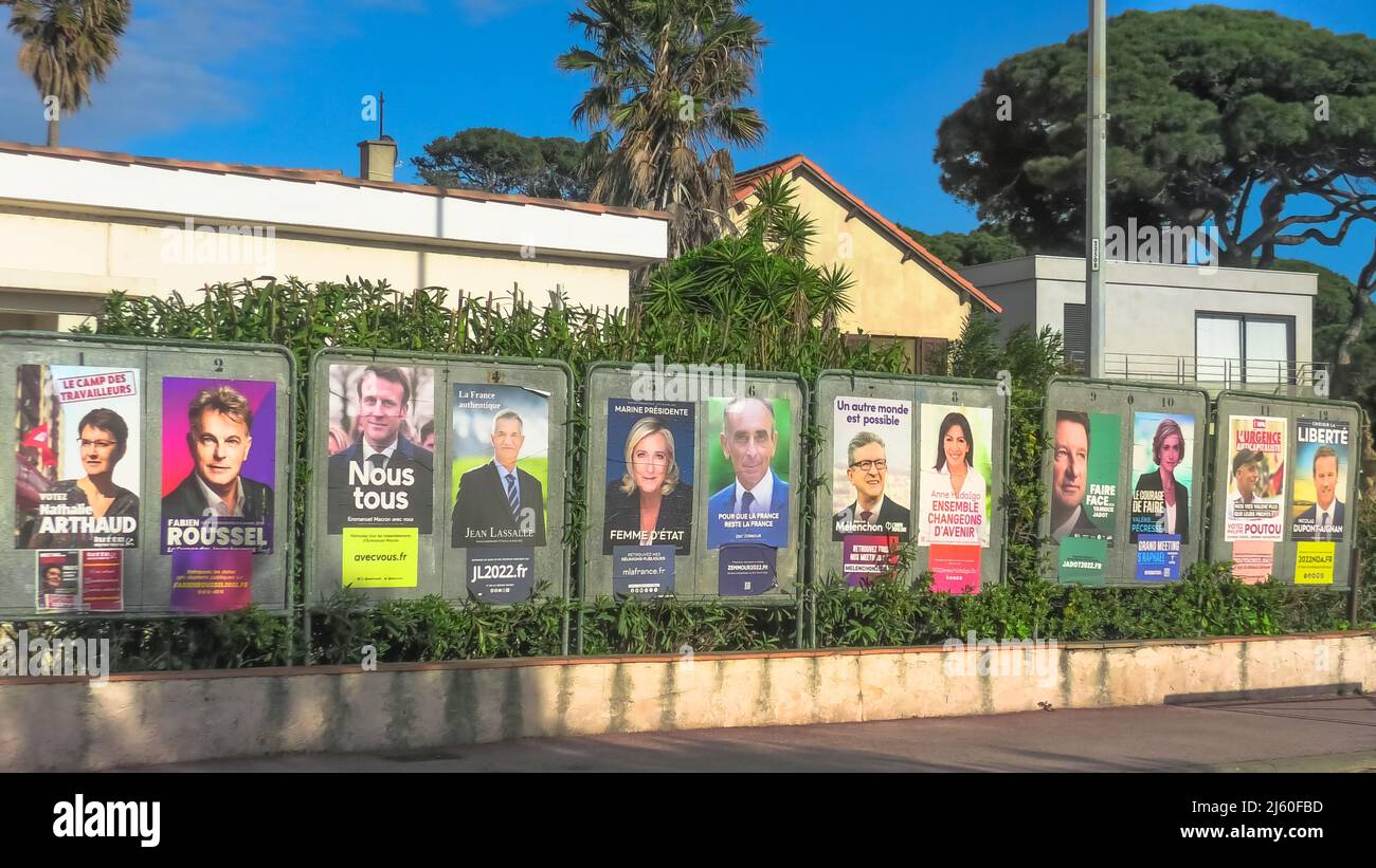 Hyeres, France - April 15, 2022: French politicians electoral posters. Nathalie Arthaud, Fabien Roussel, Emmanuel Macron, Marine Le Pen, Jean Lassalle Stock Photo