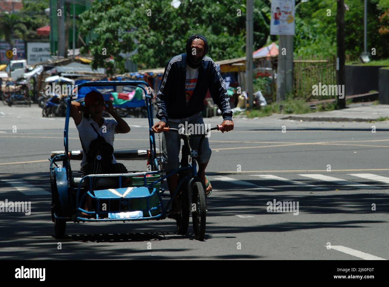Tricycle rider in downtown Bacolod City, Negros Occidental, Philippines Stock Photo Alamy