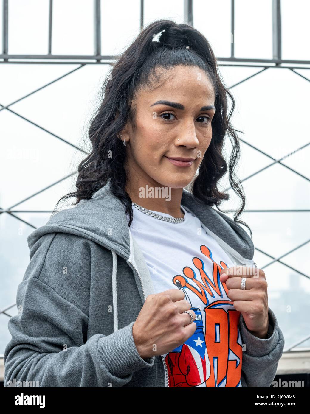 New York, USA. 26th Apr, 2022. Seven-division World Champion Amanda Serrano of Puerto Rico poses during a promotional event at the observatory atop the Empire State building. Serrando and Undisputed World Lightweight Champion Katie Taylor of Ireland, the top two female boxers in the world, turned on the lights of the iconic New York City landmark with the colors of Ireland and Puerto Rico ahead of their history-making fight at the Madison Square Garden for the undisputed World Lightweight Title on Saturday. Credit: Enrique Shore/Alamy Live News Stock Photo