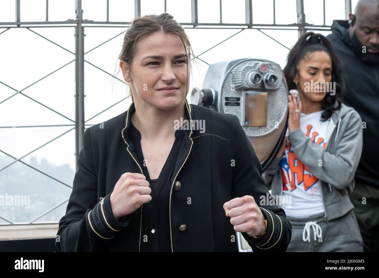 New York, USA. 26th Apr, 2022. Undisputed World Lightweight Champion Katie Taylor of Ireland (L) poses in front of Seven-division World Champion Amanda Serrano of Puerto Rico during a promotional event at the observatory atop the Empire State building. The top two female boxers in the world turned on the lights of the iconic New York City landmark with the colors of Ireland and Puerto Rico ahead of their history-making fight at the Madison Square Garden for the undisputed World Lightweight Title on Saturday. Credit: Enrique Shore/Alamy Live News Stock Photo