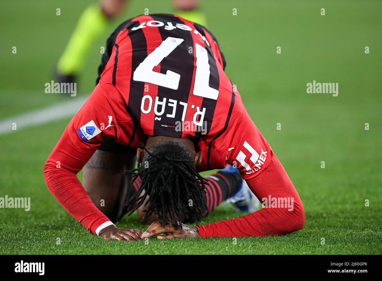 Rafael Leao of AC Milan lies down injured during the Serie A match ...