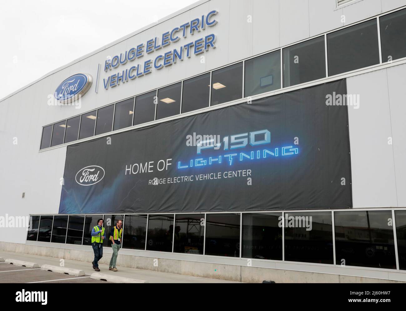 A banner for the all-new Ford F-150 Lightning electric pickup truck is seen outside the Rouge Electric Vehicle Center in Dearborn, Michigan, U.S., April 26, 2022. REUTERS/ Rebecca Cook Stock Photo