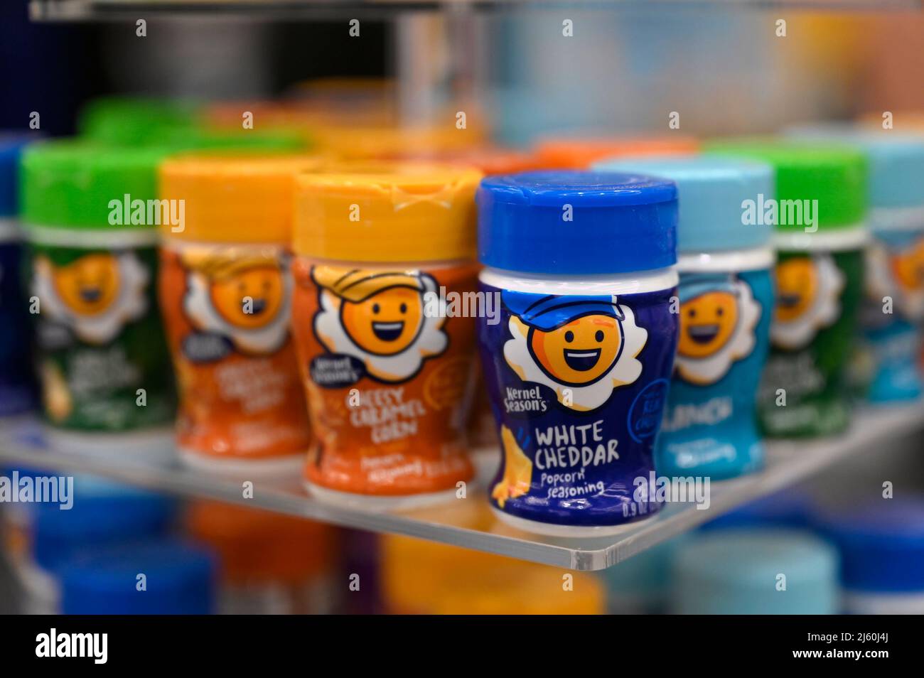 Flavored popcorn toppers are display at the Sauer Brands booth on the