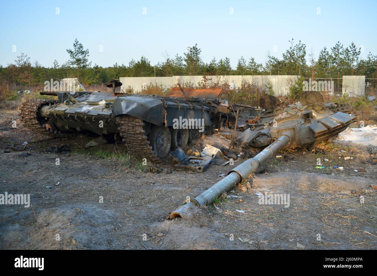 Dmytrivka village, Kyiv region, Ukraine - Apr 14, 2022: Destroyed Russian tank with a white painting V following the Ukrainian forces counter-attacks. Stock Photo
