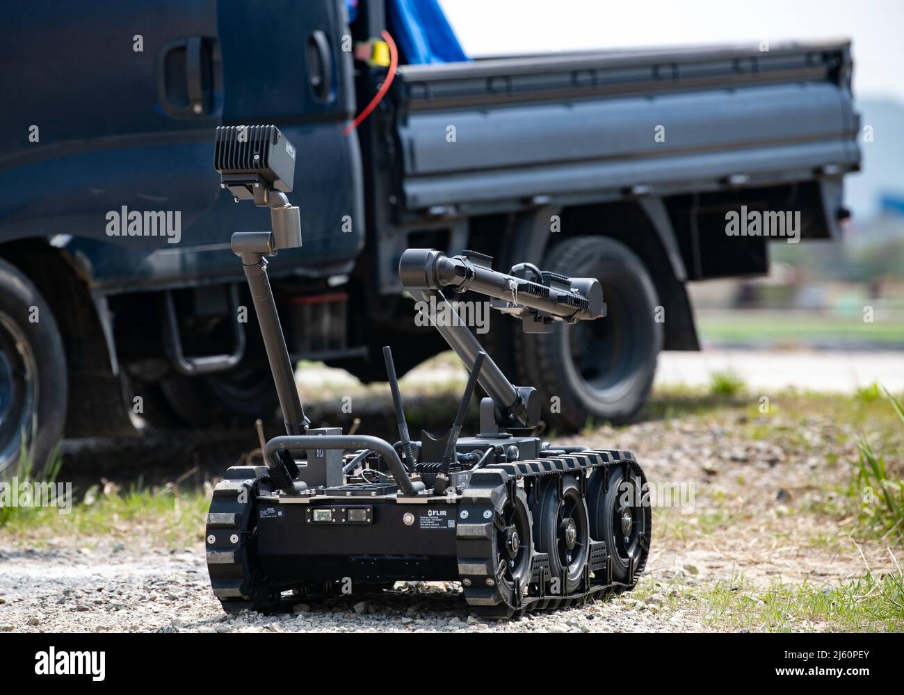 A Man Transportable Robotic System (MTRS) - Increment II robot advances toward a vehicle with a simulated suspected explosive during a training event at Kunsan Air Base, Republic of Korea, April 22, 2022. The MTRS is a remotely operated, medium-sized robotic system that enables Explosive Ordnance Disposal units to detect, confirm, identify and dispose of unexploded explosive ordnance and other hazards from a safe distance. (U.S. Air Force photo by Staff Sgt. Gabrielle Spalding) Stock Photo