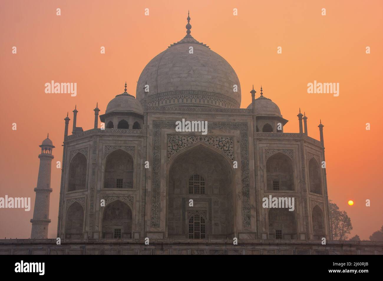Taj Mahal at sunrise, Agra, Uttar Pradesh, India. Taj Mahal was designated as a UNESCO World Heritage Site in 1983. Stock Photo