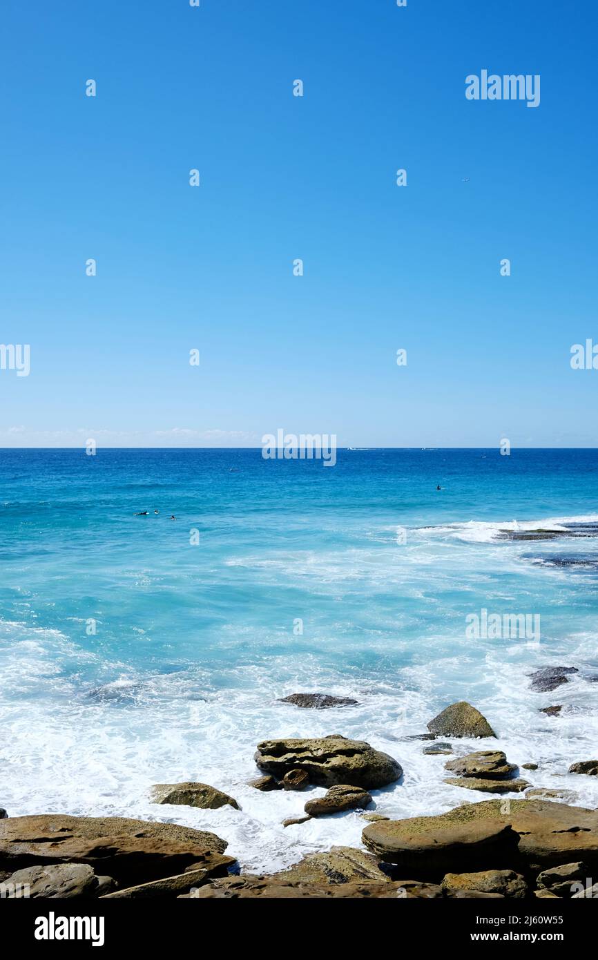 Clear blue skies and waters at Tamarama Beach, on the eastern coast of Sydney, New South Wales, Australia Stock Photo