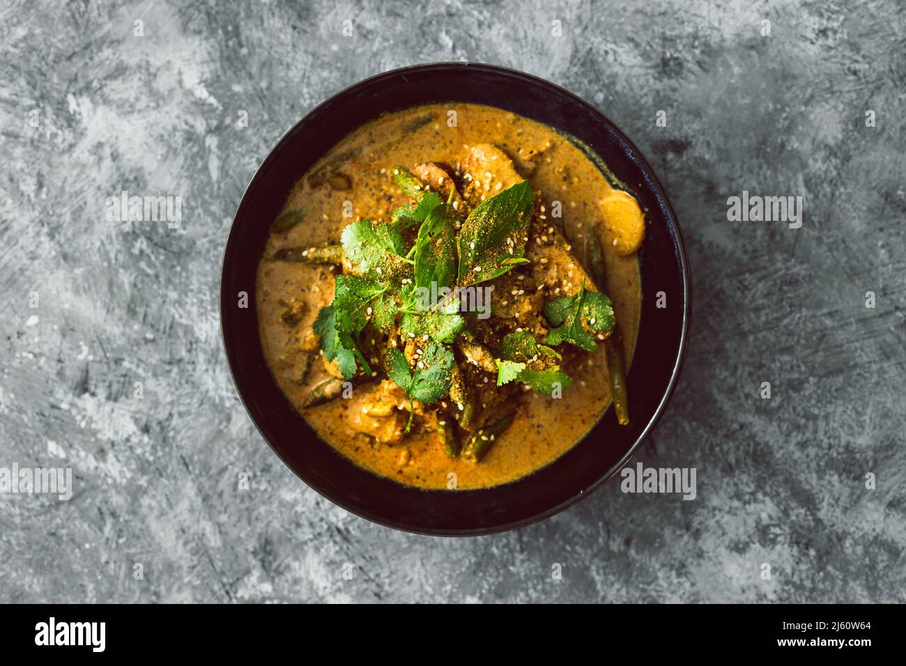 vegan tempeh curry with water chestnut green beans and fresh herbs