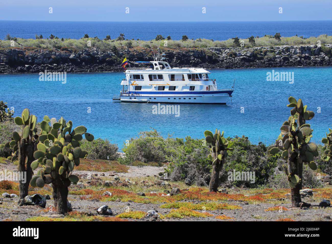 Typical tourist yacht anchored between South Plaza and North Plaza islands, Galapagos National Park, Ecuador. Stock Photo