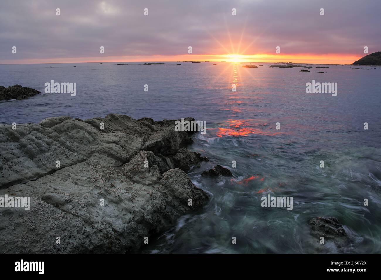Sunrise on Kaikoura peninsula, South Island, New Zealand. The area is a popular ecotourism destination Stock Photo