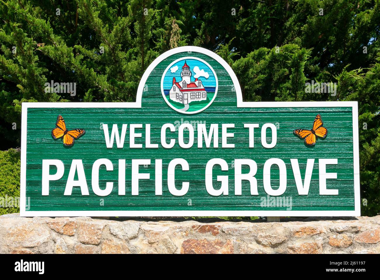 Welcome to Pacific Grove road sign with monarch butterflies - Pacific Grove, California, USA - 2022 Stock Photo