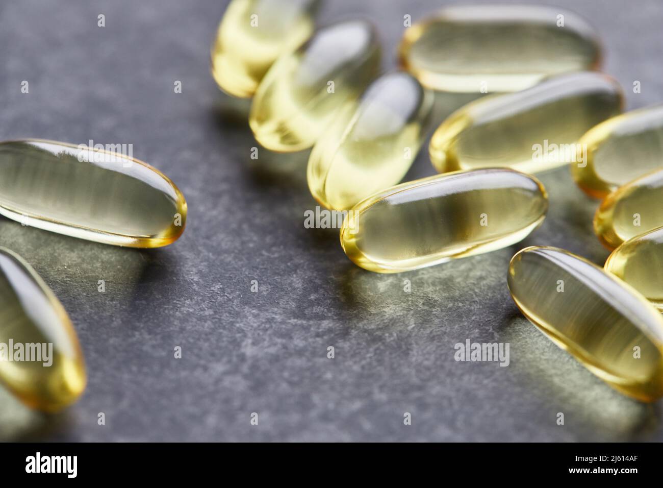 Capsules of omega3 fatty acids on a gray background. The concept of