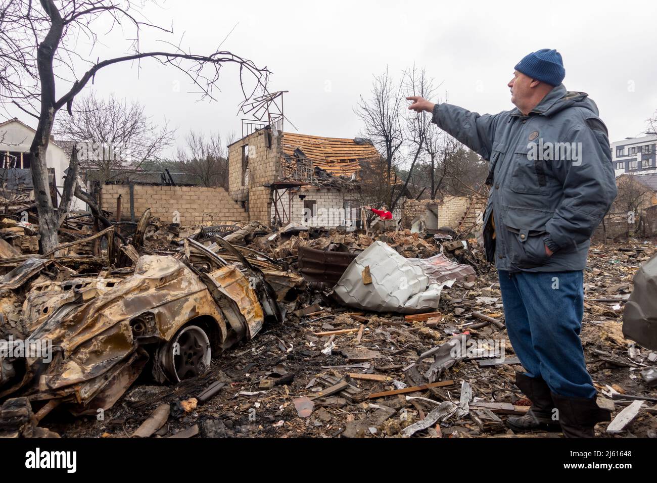 IRPIN, UKRAINE 03 March. A Ukrainian civilian views a house destroyed