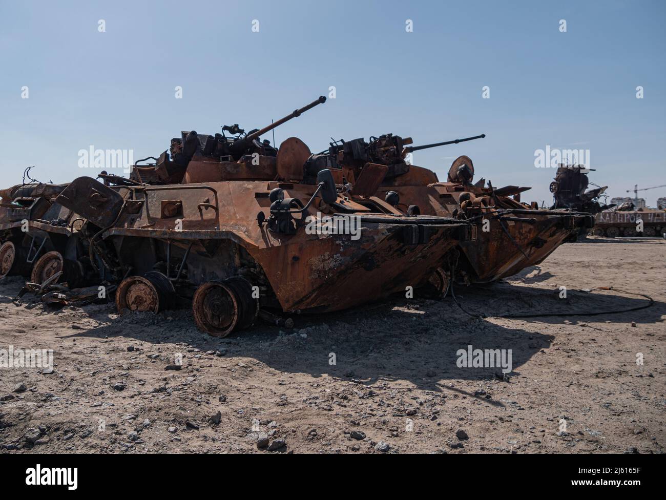 Bucha, Ukraine - April 2022: Broken tanks and combat vehicles of the Russian invaders in the village of Bucha, Kiev region. Cemetery of burnt military equipment. Armored personnel carrier - BTR Stock Photo