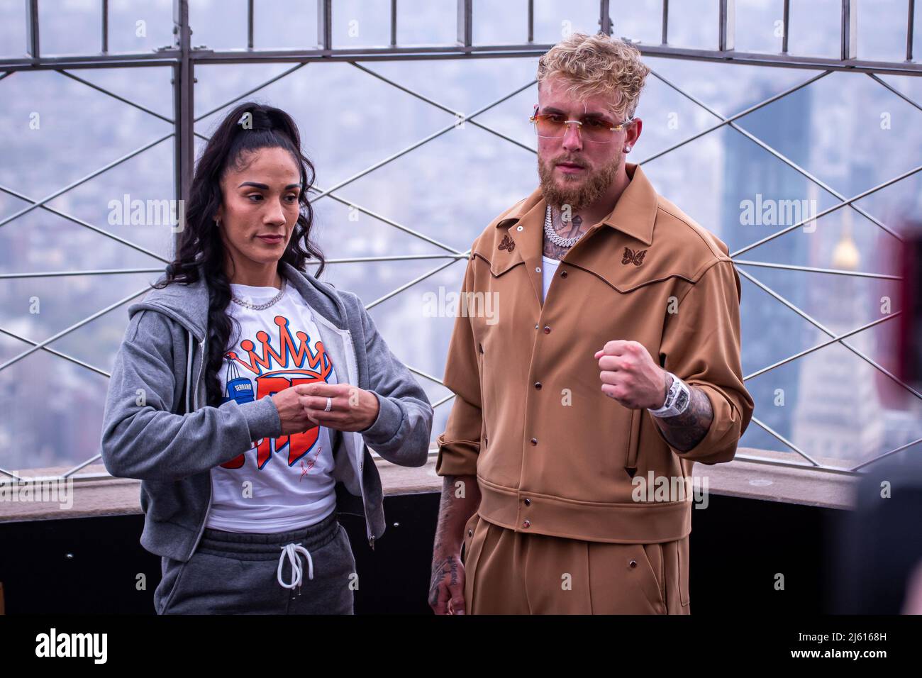 NEW YORK, NY - APRIL 26: (L-R) Amanda Serrano stands with Jake Paul atop the Empire State Building after the todays face off ahead of their Undisputed Title Fight on Saturday night (April 30) at Madison Square Garden on April 26, 2022 in New York, NY, United States. (Photo by Matt Davies/PxImages) Credit: Px Images/Alamy Live News Stock Photo
