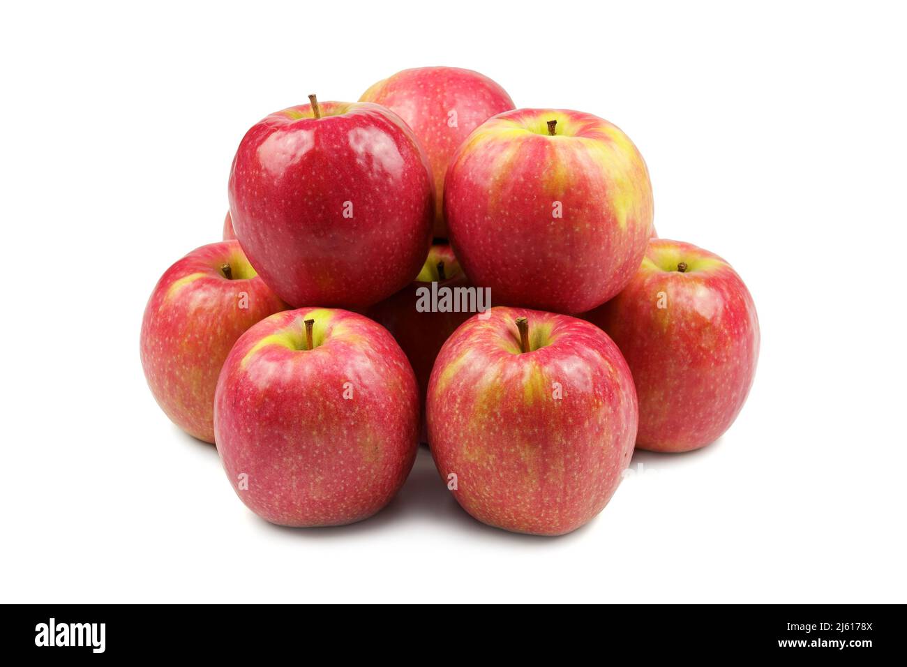 Group of red apples isolated on white background forming a huddled group. Stock Photo