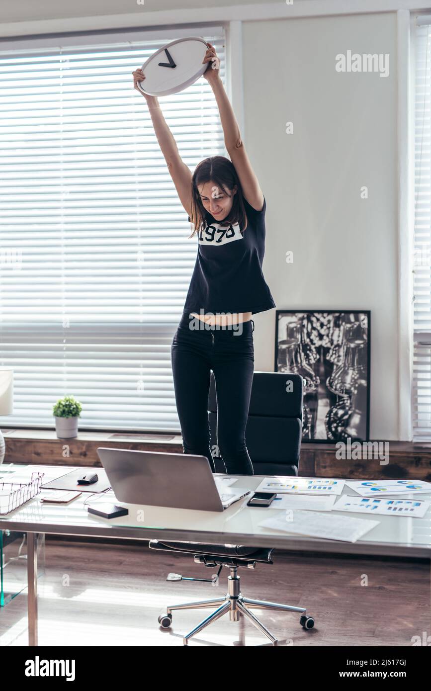Woman is happy at the end of the working day Stock Photo Alamy