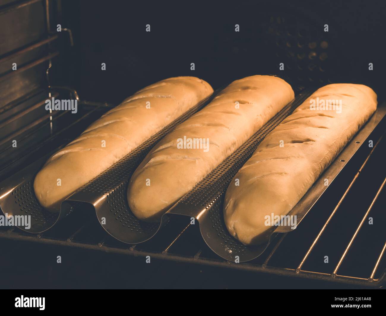 image shows how to bake baguette or french bread in oven Stock Photo