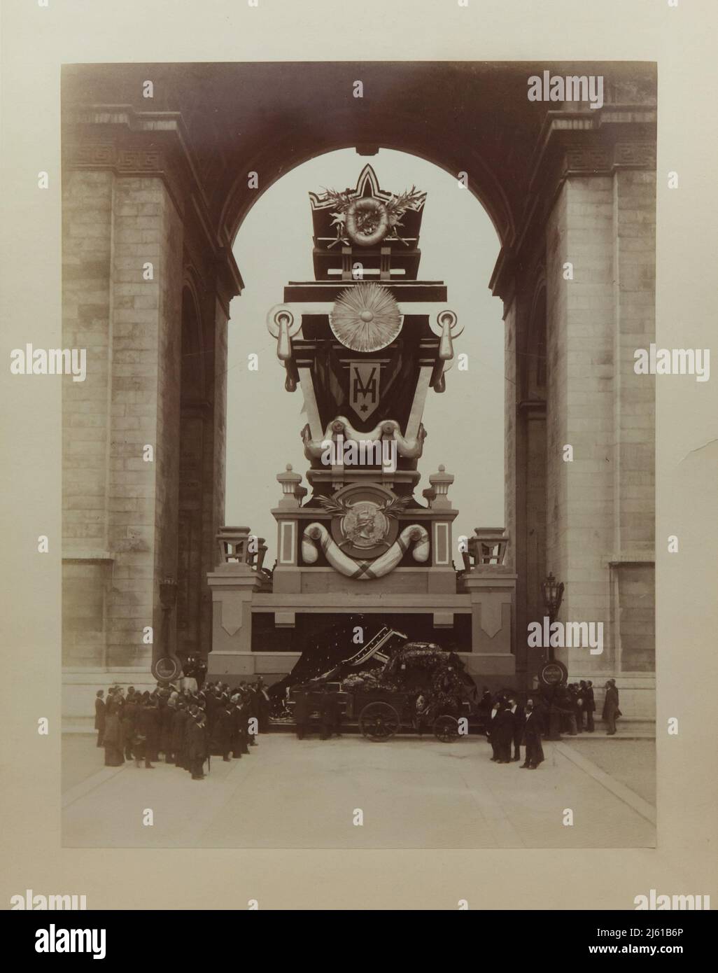 Catafalque of French novelist Victor Hugo under the Arc de Triomphe in Paris, France, during the state funeral of Victor Hugo in May 1885. Black and white photograph taken by French photographer Louis-Antonin Neurdein on 31 May 1885. The huge cenotaph under the Arc de Triomphe was designed by French architect Charles Garnier. Stock Photo