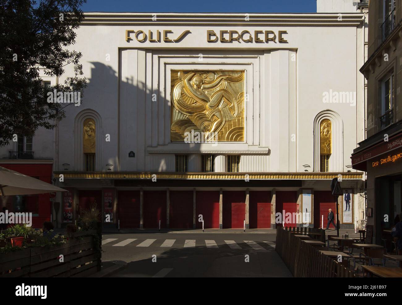 Main facade of the Folies Bergère Cabaret in Paris, France. Russian ballerina Lila Nicolska also known as Elisabeth Nikolskaia and Jelizaveta Nikolská (1904-1955) is depicted in the gilded relief 'La danseuse' designed by French sculptor Maurice Pico (1926). Stock Photo