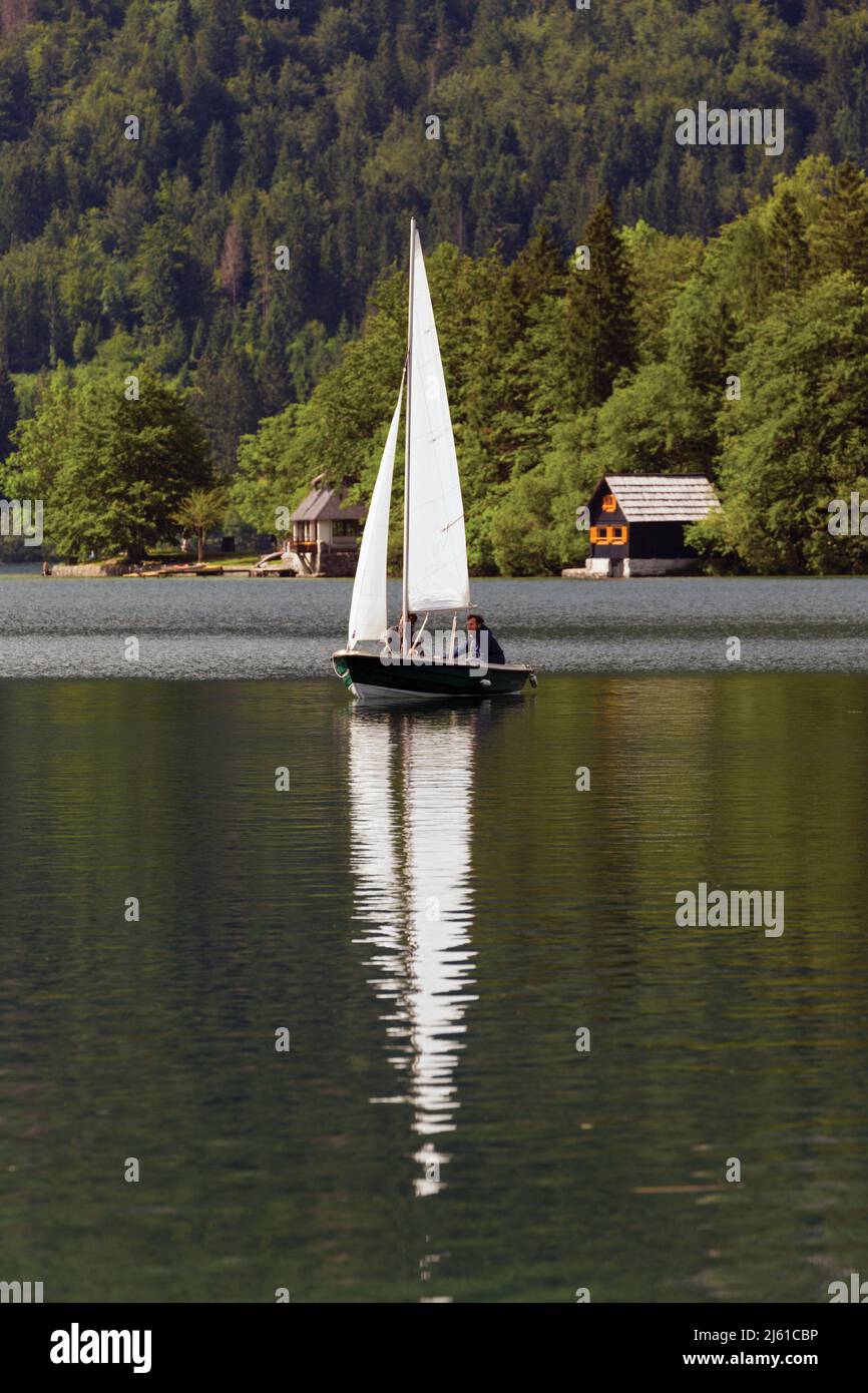 Lake Bohinj (Bohinjsko jezero), Triglav National Park, Slovenia.  Sailing on the lake. Stock Photo