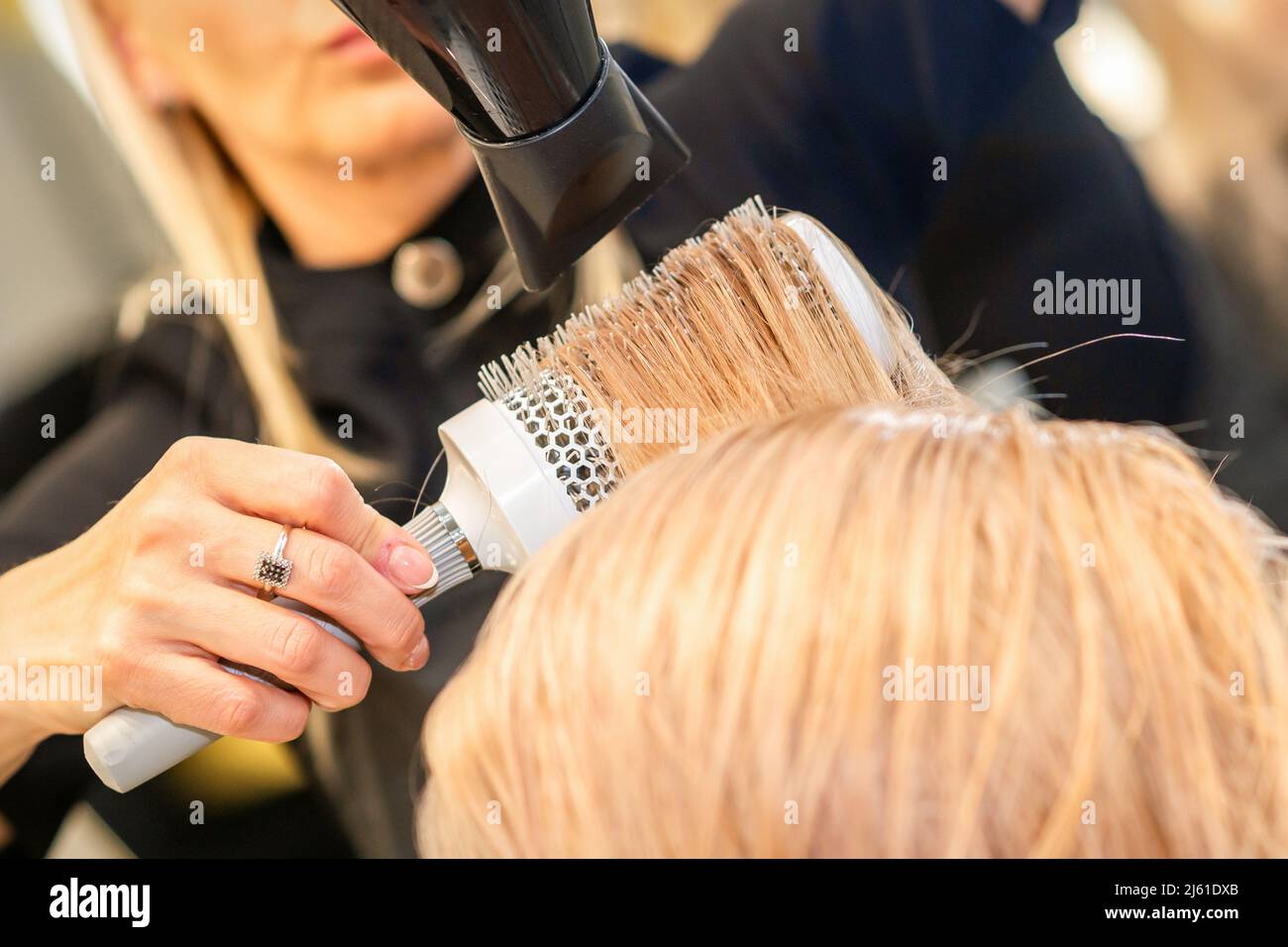 Hair blonde dryer round brush hi-res stock photography and images - Alamy