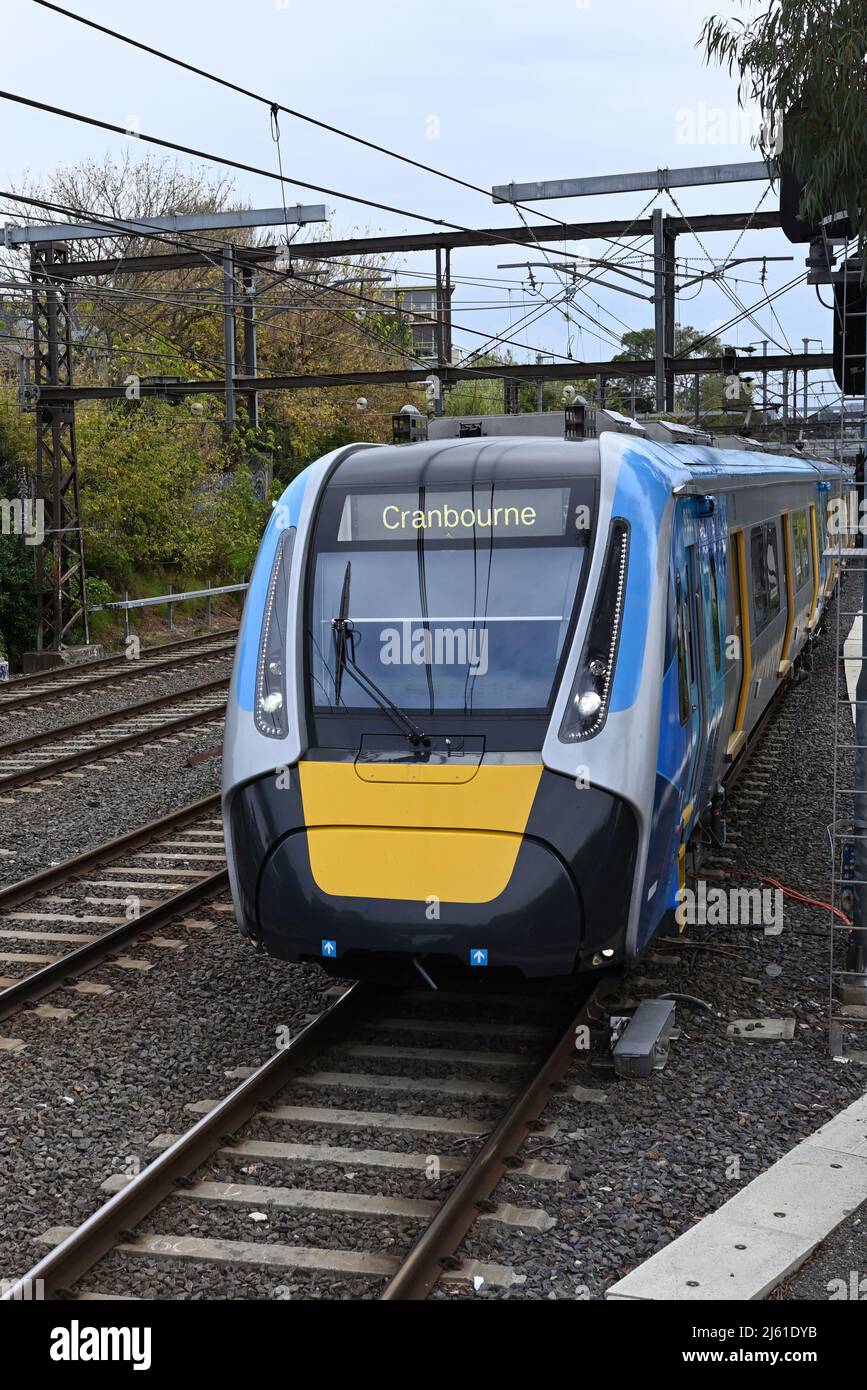Front view of a High Capacity Metro Train, as it passes a signal, while it travels towards Cranbourne, in metropolitan Melbourne Stock Photo