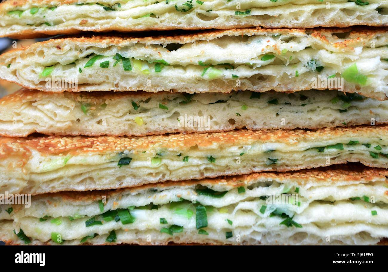 Cong you bing is a traditional Chinese scallion oil pancake / flatbread. Nanjing, China. Stock Photo