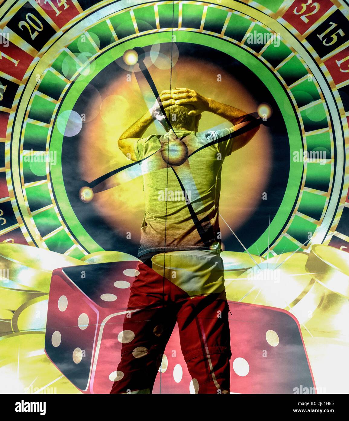 Rear view of man with hands on head overlayed on roulette wheel. Gambling, debt, addiction... Stock Photo