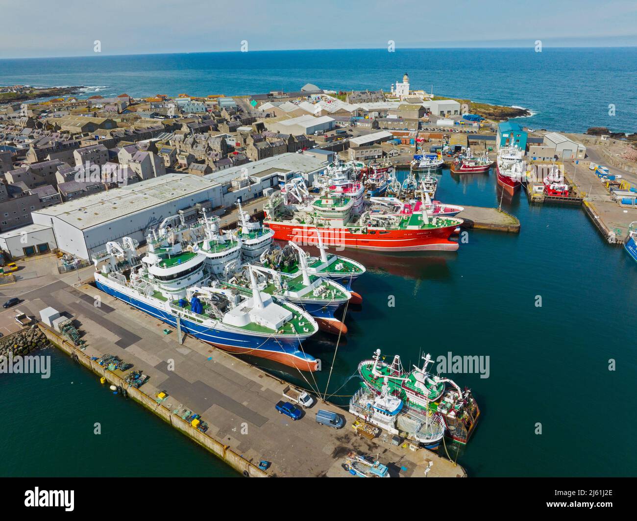 Aerial view of trawlers in fishing port and harbour at Fraserburgh in Aberdeenshire, Scotland, UK Stock Photo