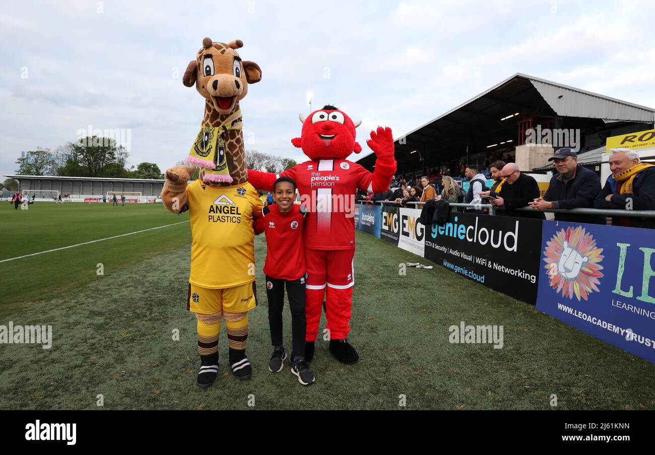 Sutton, UK 26th April 2022 : Sutton United mascot  'Jenny' the giraffe and Crawley Town’s mascot Reggie the Red Devil seen before the EFL League Two match between Sutton United and Crawley Town at tSutton Football Club. Credit: James Boardman/Alamy Live News Stock Photo