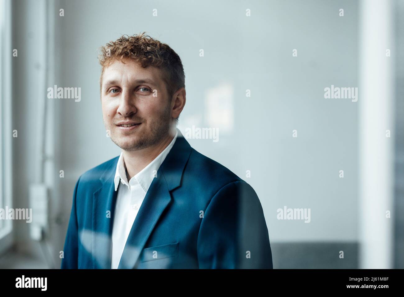 Businessman with red hair in office Stock Photo