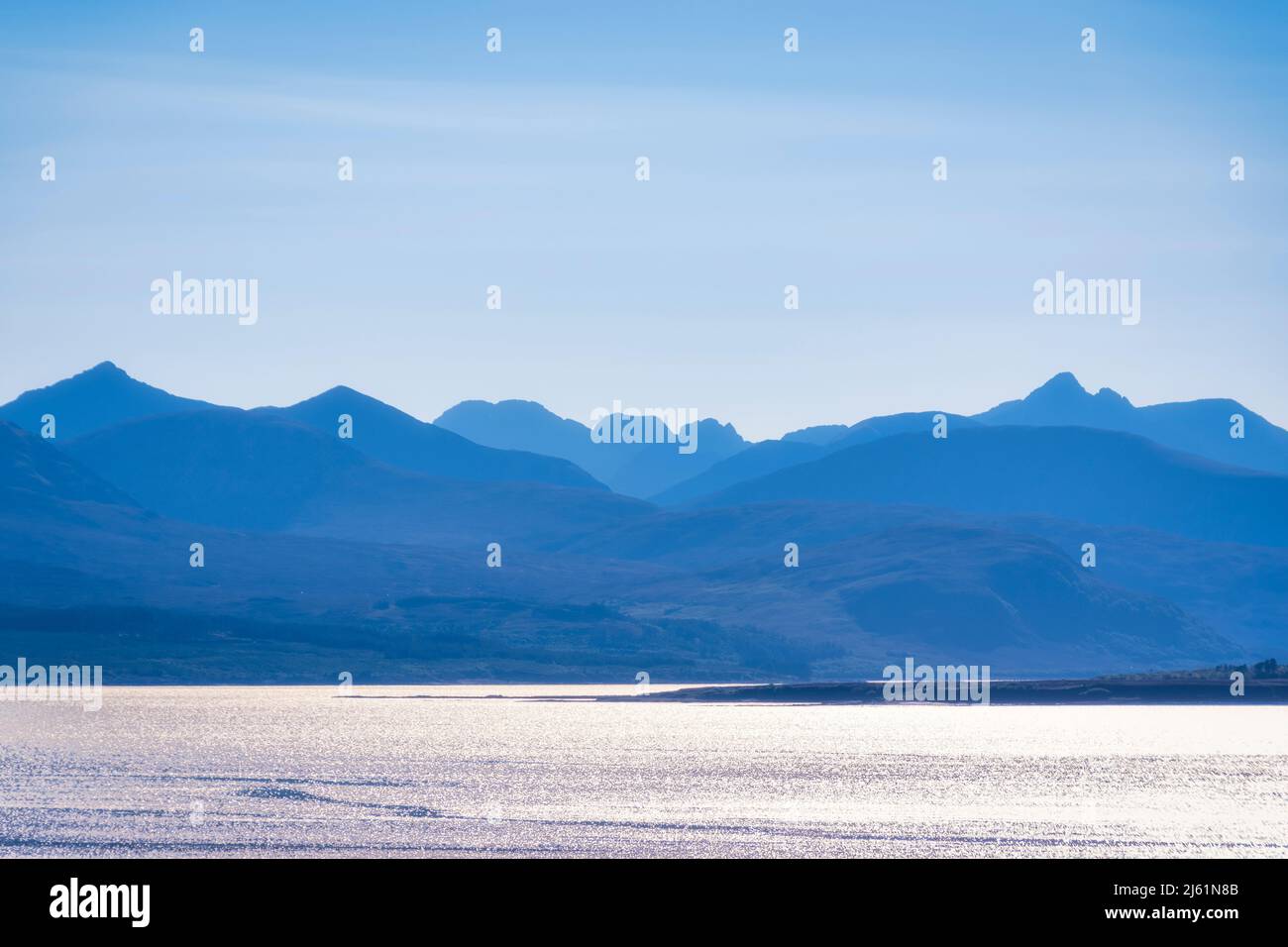 Cuillin mountain range by sea Stock Photo