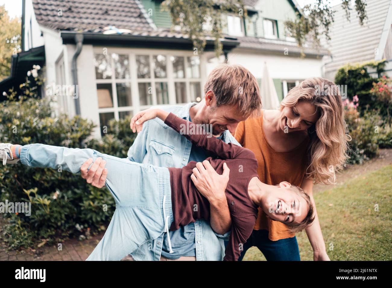 Happy family enjoying together at backyard Stock Photo