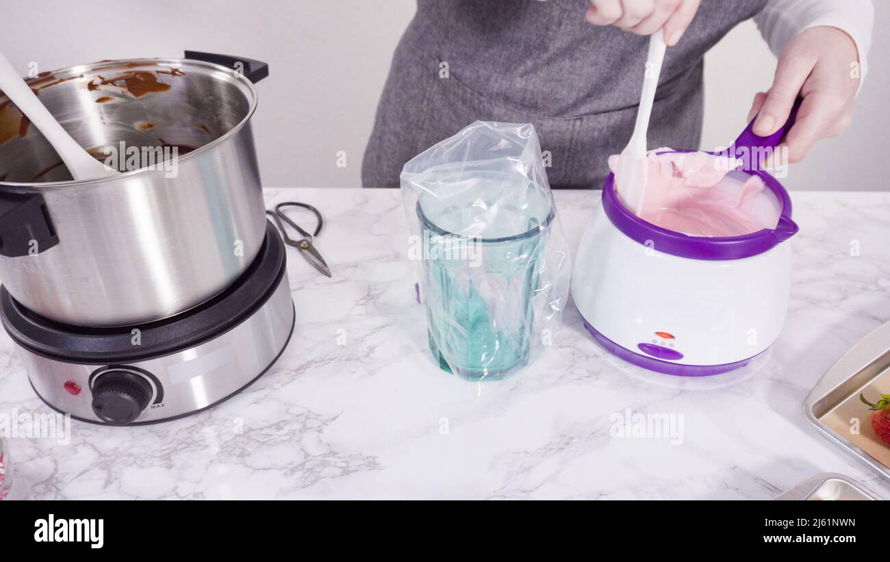 Step by step. Melting chocolate chips in chocolate melting pots Stock Photo Alamy