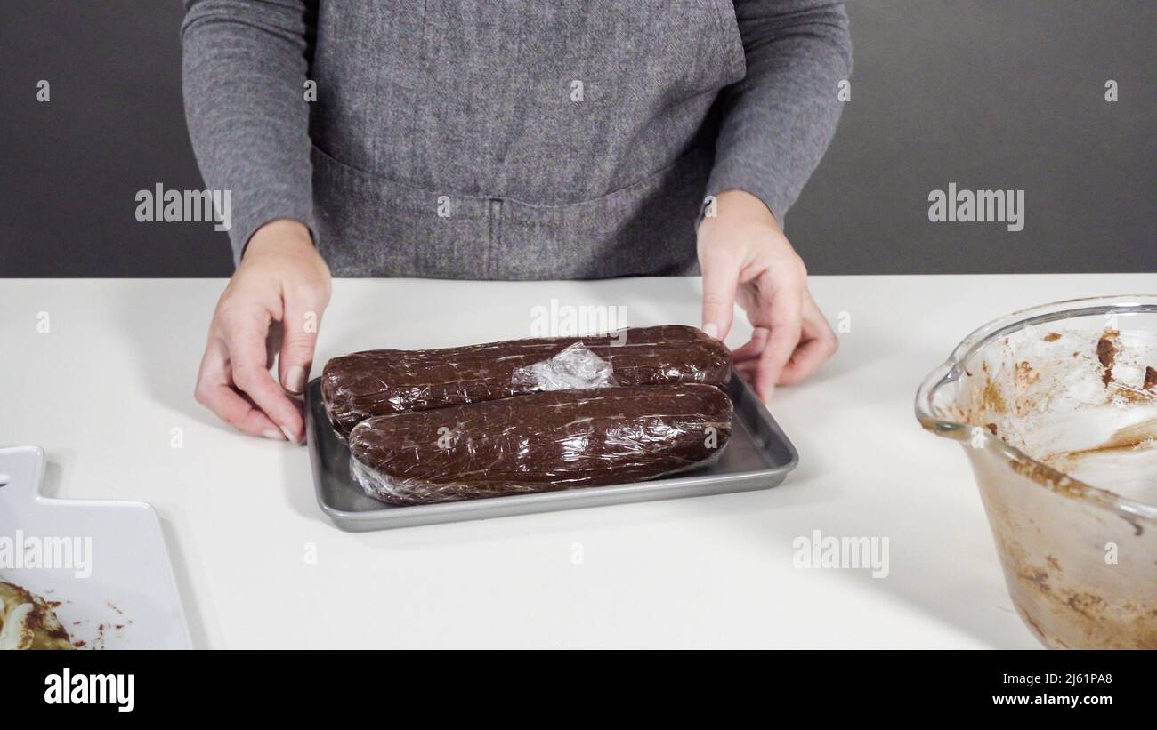 Step by step. Wrapping cookie dough into the plastic wrap to bake