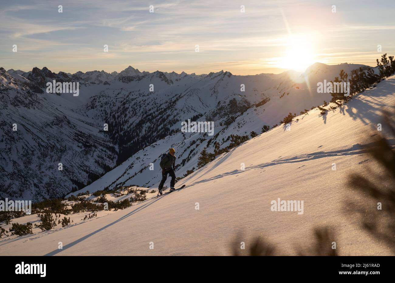 Man walking on snowcapped mountain Stock Photo
