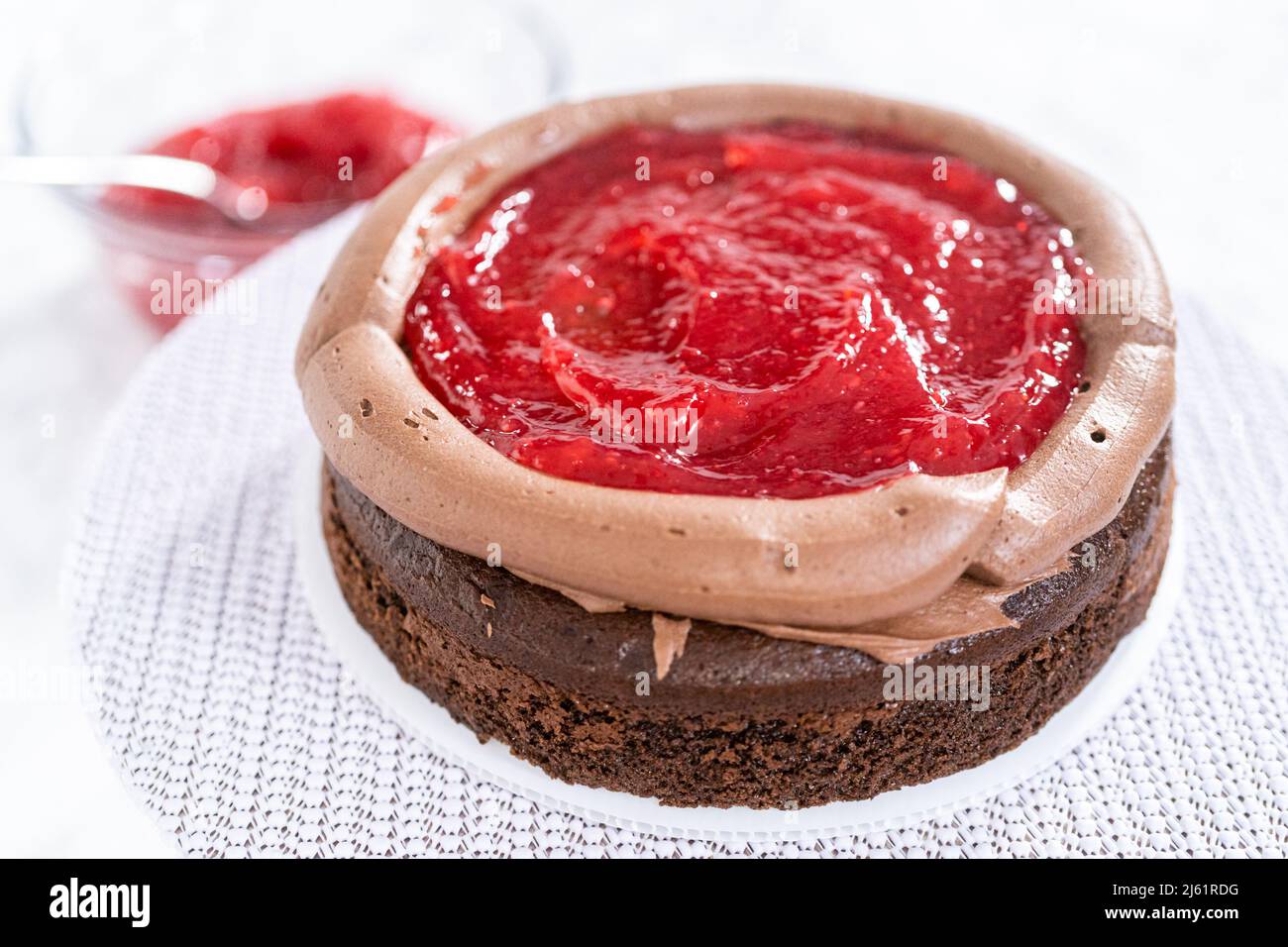 Covering chocolate cake with a crumb layer of chocolate buttercream