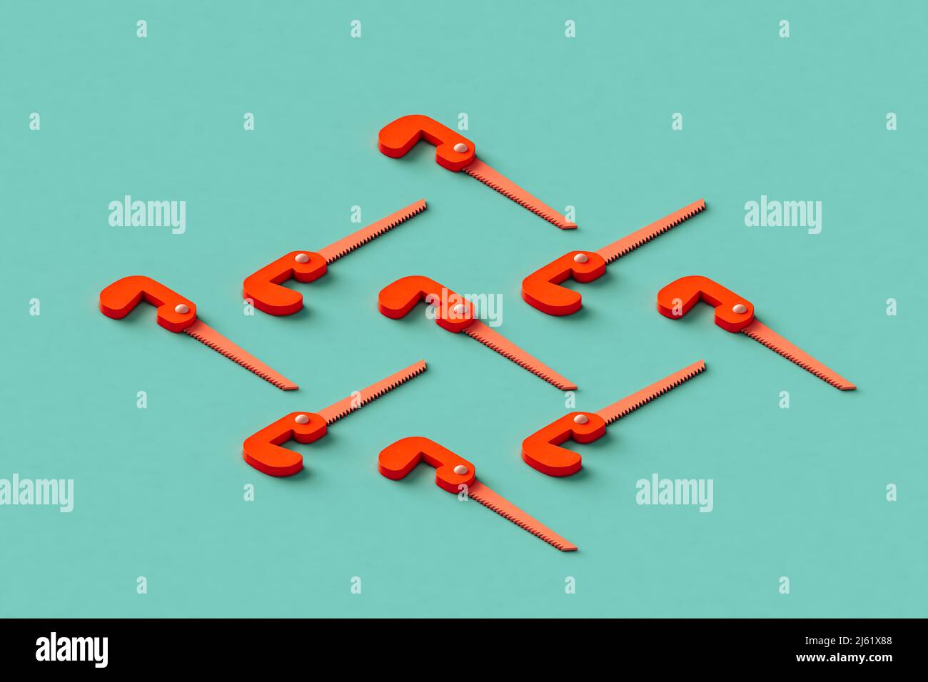 Three dimensional render of red hand saws flat laid against green background Stock Photo