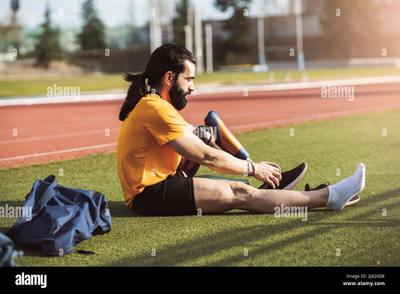 Bearded man wearing shoes on prosthetic leg Stock Photo