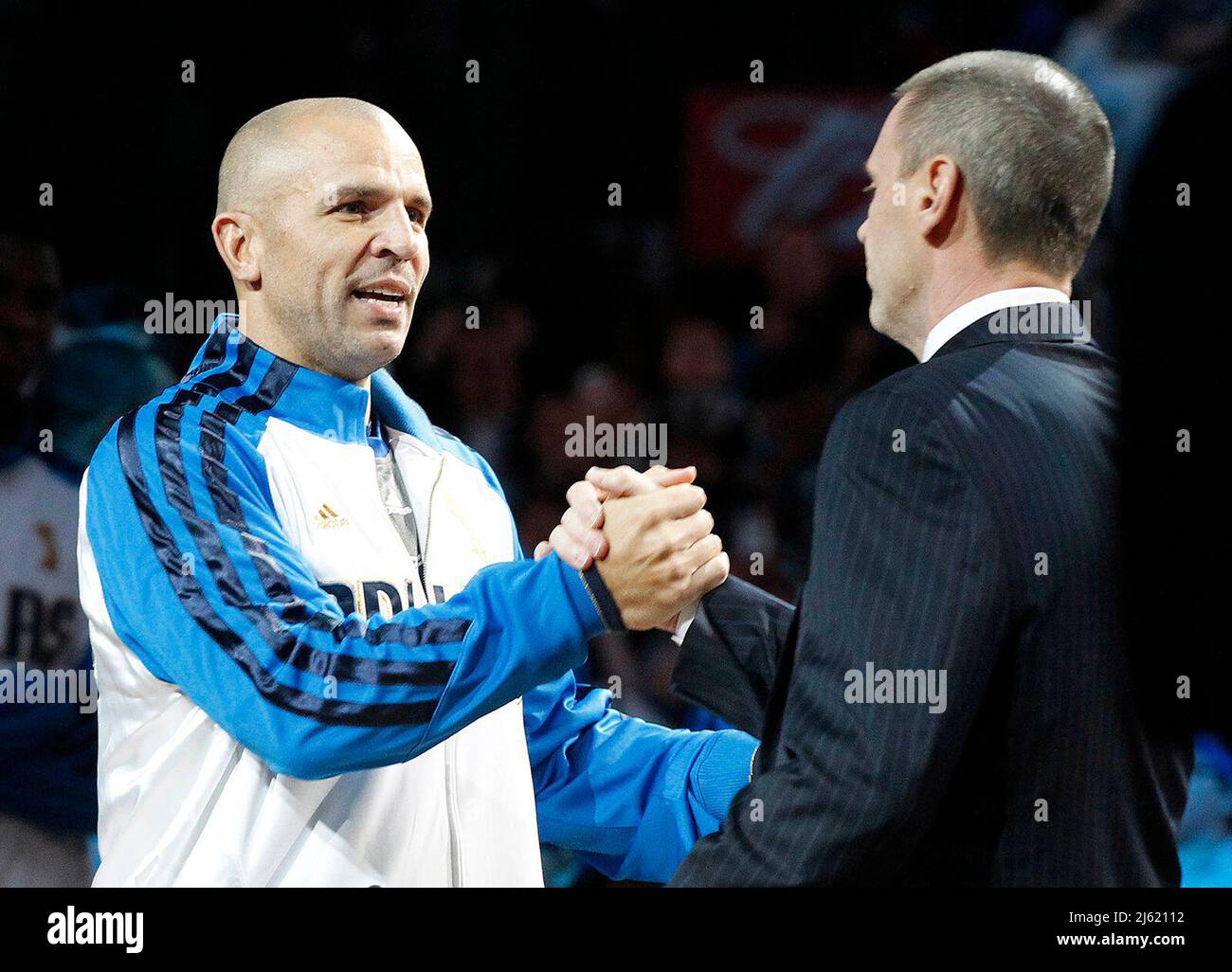 Dallas, USA. 25th Jan, 2012. The Dallas Mavericks' Jason Kidd is greeted by coach Rick Carlisle, right, while receiving his championship ring before the team plays host to the Minnesota Timberwolves at the American Airlines Center in Dallas, Texas, on Wednesday, January 25, 2012. (Photo by Ron T. Ennis/Fort Worth Star-Telegram/TNS/Sipa USA) Credit: Sipa USA/Alamy Live News Stock Photo