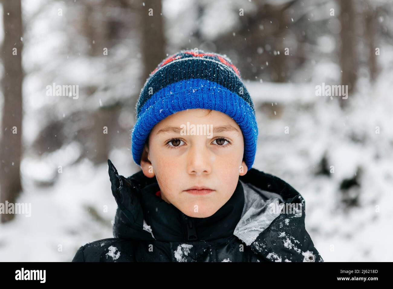 Boy wearing knit hat in winter Stock Photo