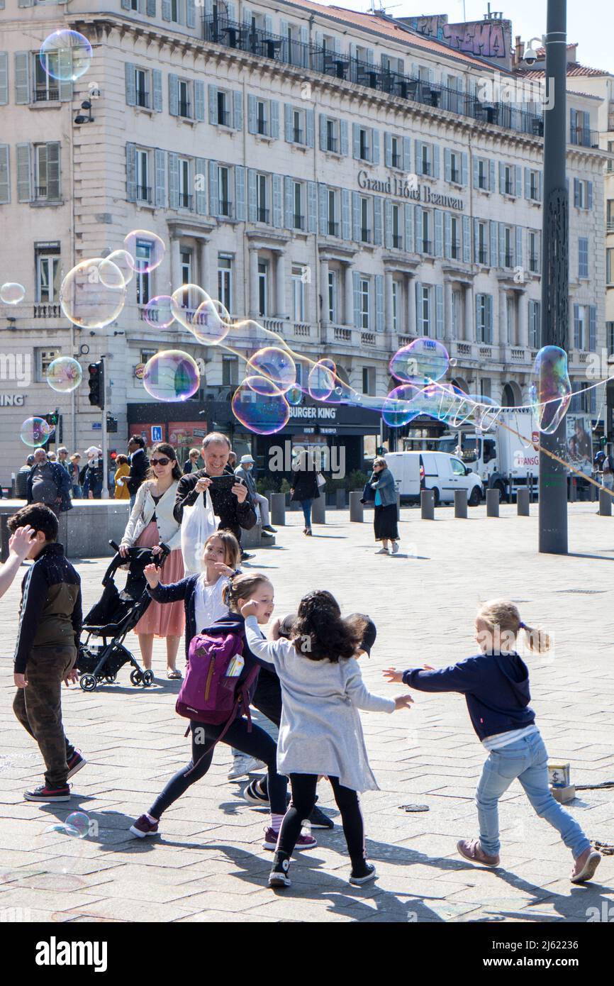 Children playing with soap bubbles Stock Photo - Alamy