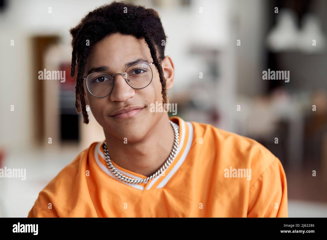 Smiling young man wearing eyeglasses Stock Photo