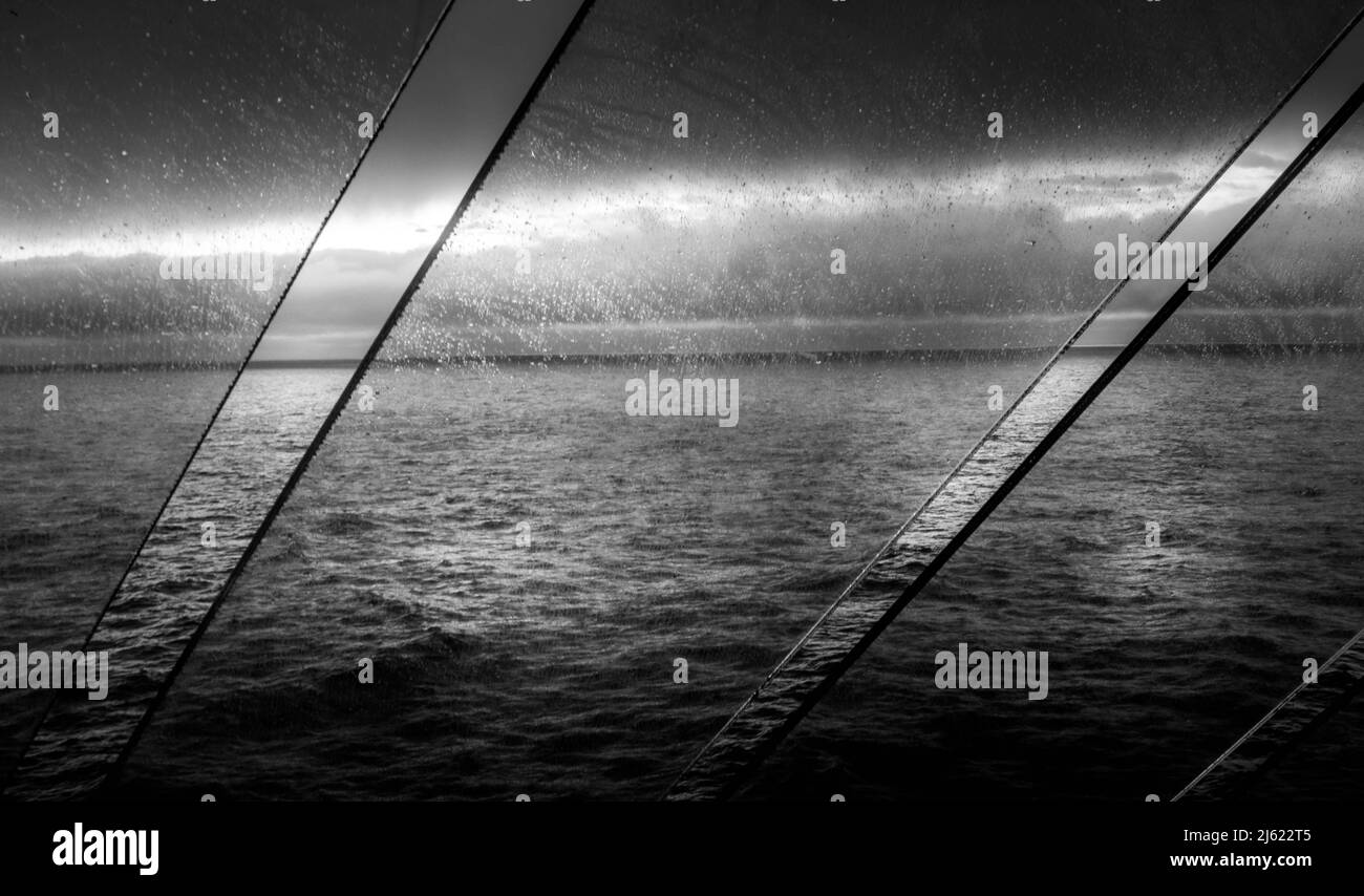 Abstract black and white diagonal, showing rain on windows during an Atlantic squall. Stock Photo